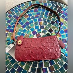 Coach Penn Small Signature Patent Leather Shoulder Bag in Enamel Red/Burgundy.